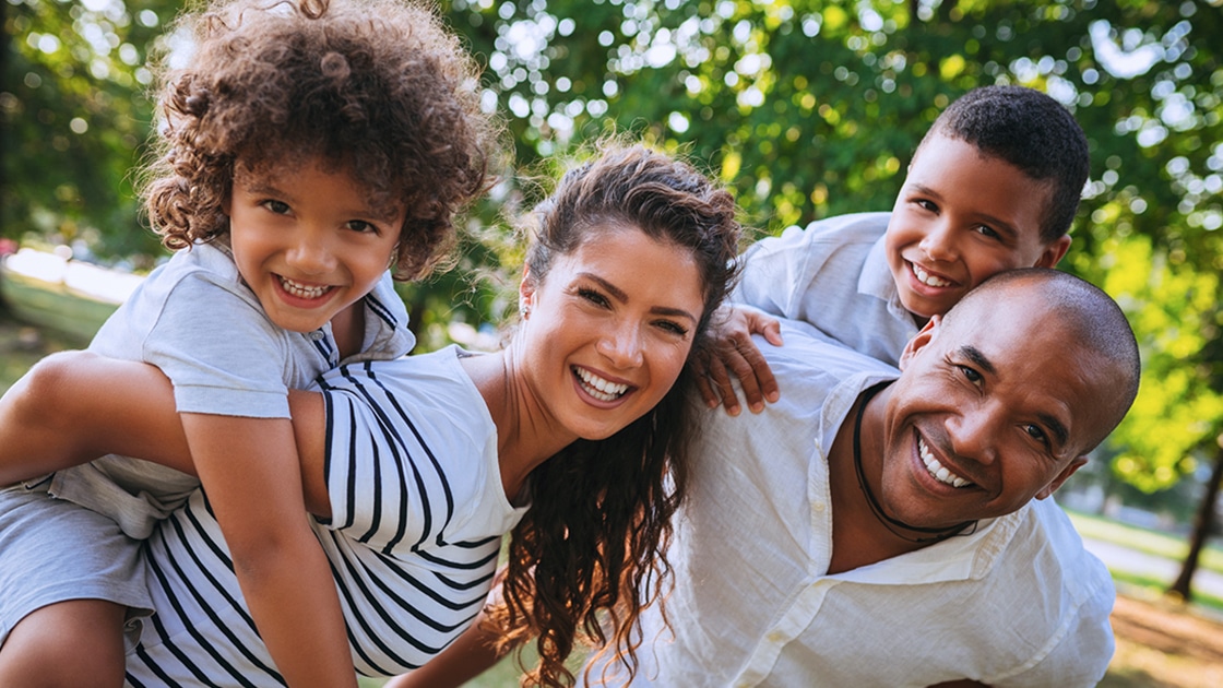 Smiling Family Outdoors Photo